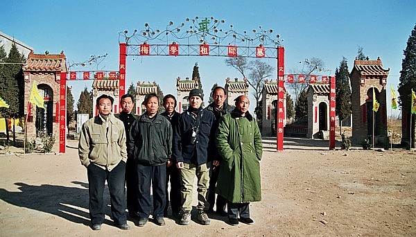 Meihuazhuang practitioners stand in front of shrine to founding ancestors